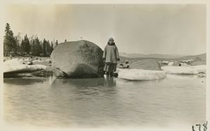 Image of Boulders that are lifted by the tide and ice. Miriam Flowers standing near larg